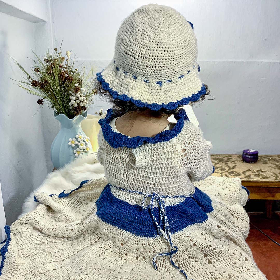 Baby blue and white dress with floral design made from Eri Silk yarn