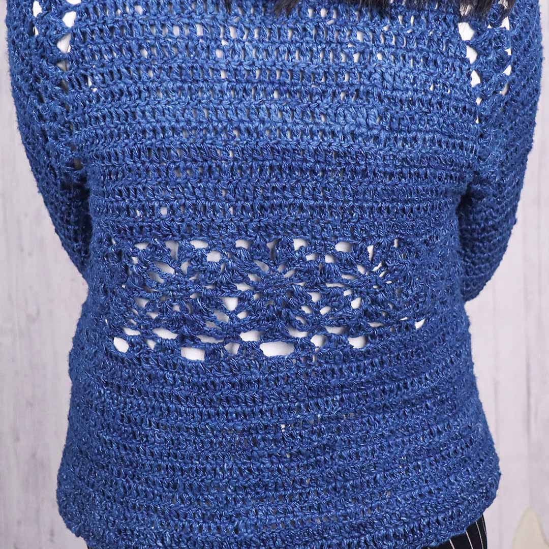 A women wearing a beautiful blue Indigo Sweater made from Eri Silk Yarn