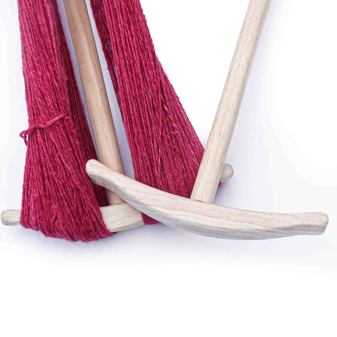 The niddy-noddy is an essential piece of spinning equipment used for winding yarn into skeins.
