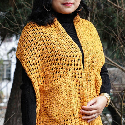 A Women Wearing A Yellow Eri Silk Crochet Pocket Shawl